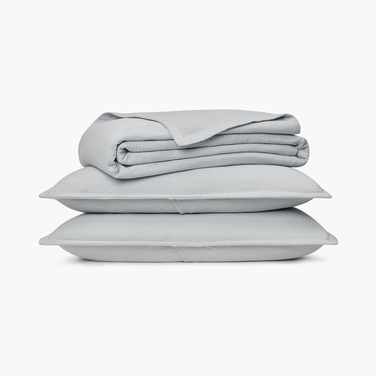 organic matelasse blanket gray stack