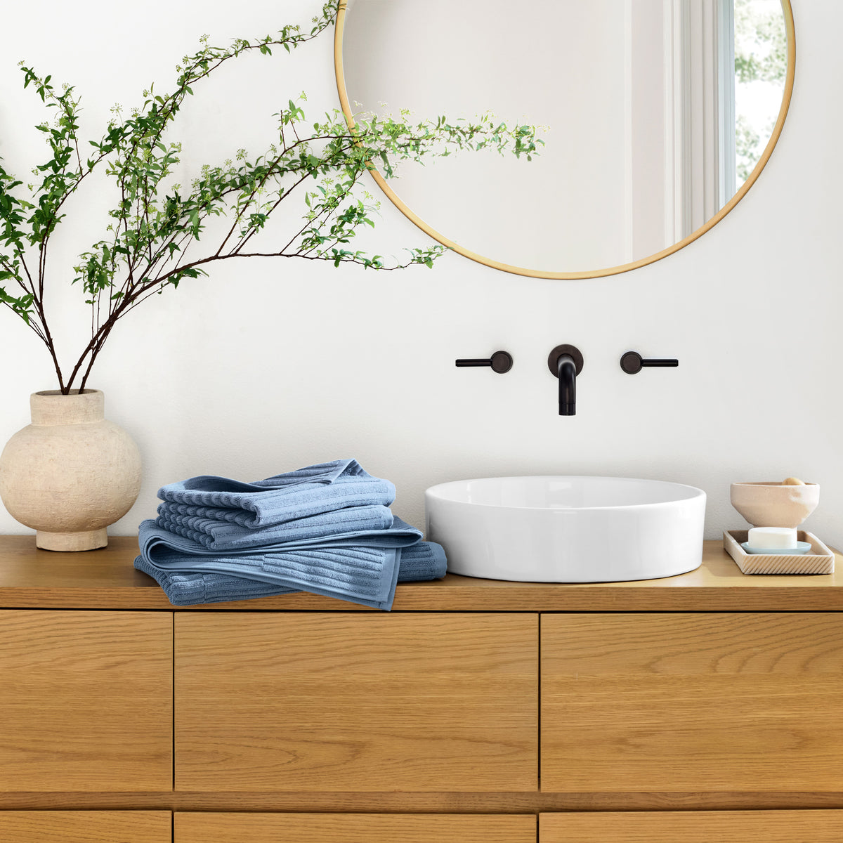 Organic Ribbed Towel In Sky Blue on Bathroom Counter