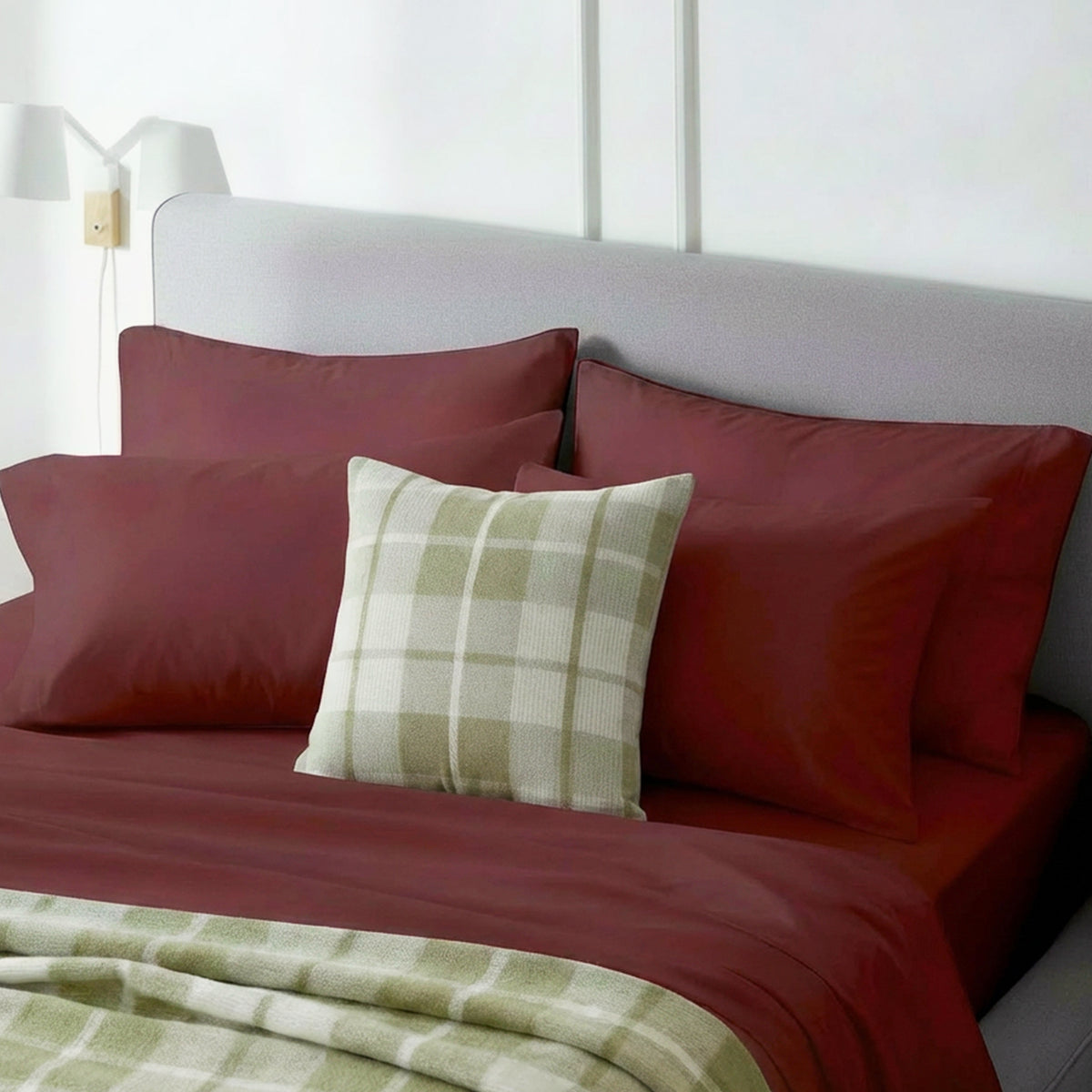 organic cotton flannel sheet set in spiced apple with plaid throw pillow and blanket