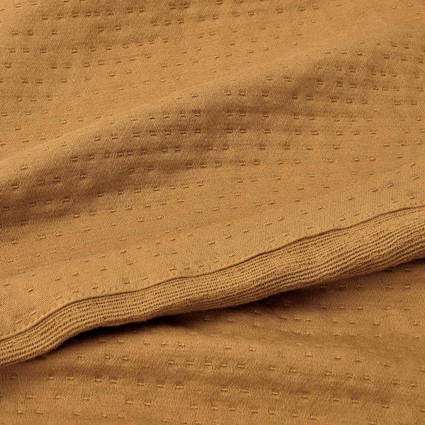 organic matelasse blanket ochre detail