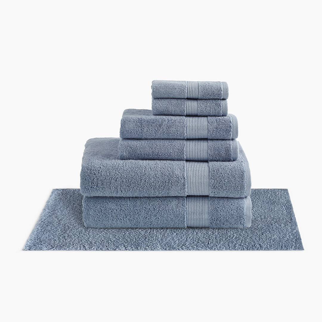 https://underthecanopy.com/cdn/shop/products/classic-organic-cotton-bath-rug-bundle-chambray-blue.jpg?v=1684519413