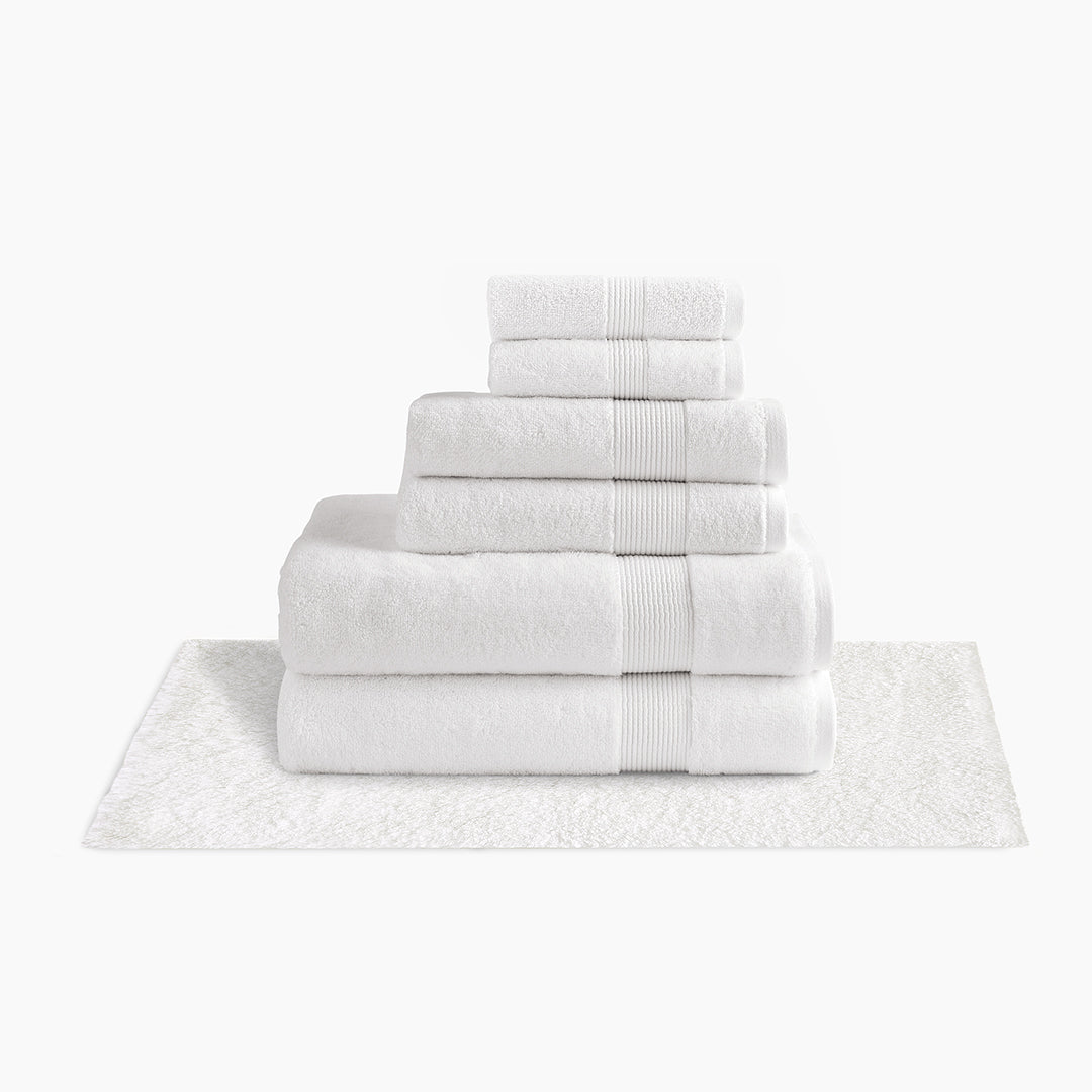 https://underthecanopy.com/cdn/shop/products/classic-organic-cotton-bath-rug-bundle-white_1200x.jpg?v=1684518935