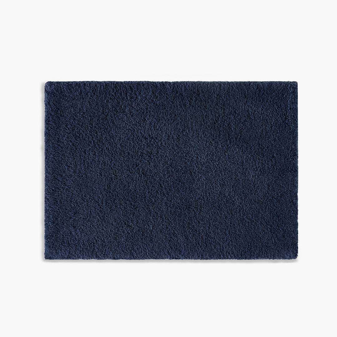 https://underthecanopy.com/cdn/shop/products/classic-organic-cotton-bath-rug-navy-blue.jpg?v=1684770047