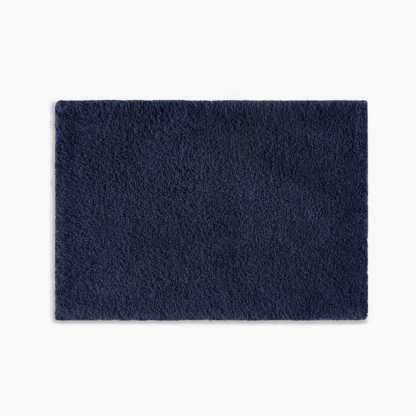 https://underthecanopy.com/cdn/shop/products/classic-organic-cotton-bath-rug-navy-blue_grande.jpg?v=1684770047