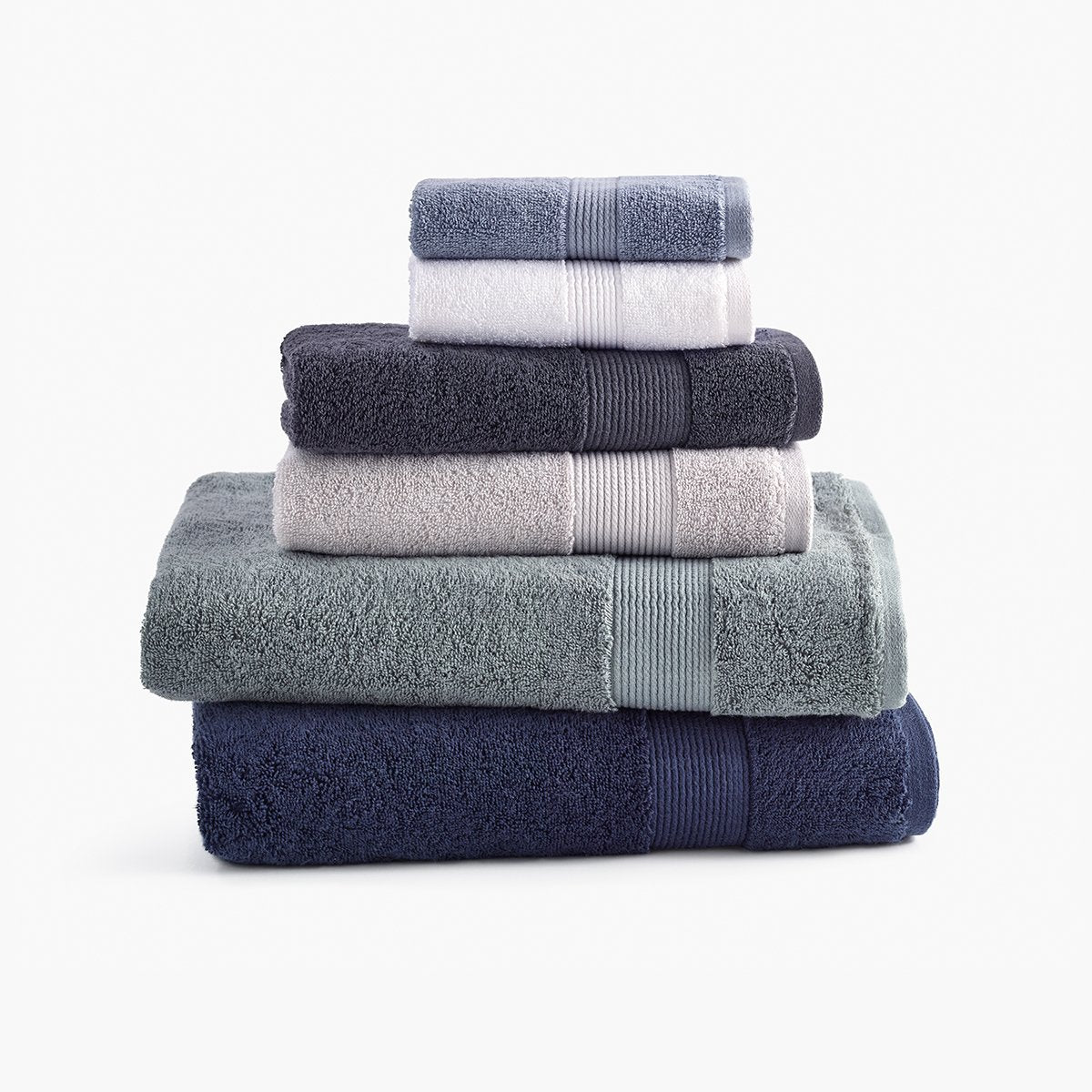 https://underthecanopy.com/cdn/shop/products/classic-organic-cotton-bath-towel-stack-chambray-blue_1200x.jpg?v=1684517913
