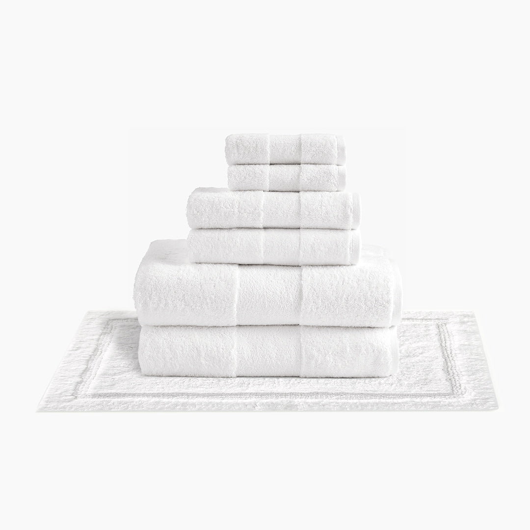 https://underthecanopy.com/cdn/shop/products/plush-organic-cotton-reversible-bath-rug-bundle-white_1200x.jpg?v=1685459228
