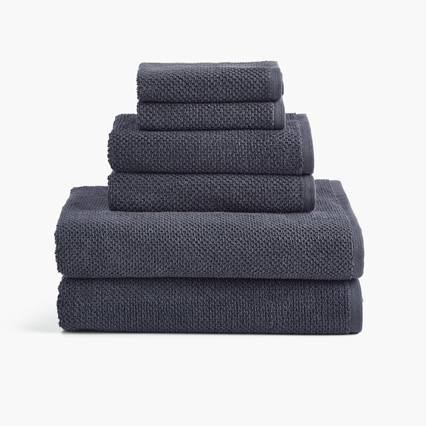 https://underthecanopy.com/cdn/shop/products/textured-organic-cotton-bath-towels-charcoal-gray-set_grande.jpg?v=1684875913