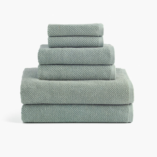 https://underthecanopy.com/cdn/shop/products/textured-organic-cotton-bath-towels-lichen-green-set_grande.jpg?v=1684875660